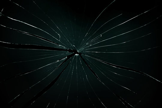 Broken and cracked glass with hole
