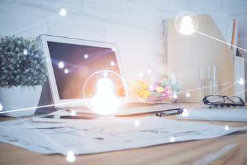 Computer on desktop with social network hologram. Multi exposure. Concept of international people connections.