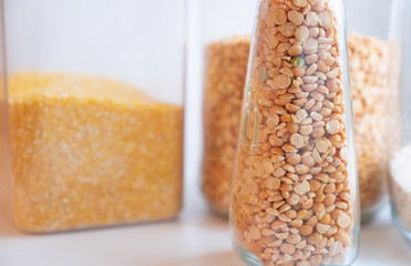 Beautiful cereals in a glass can on a white background