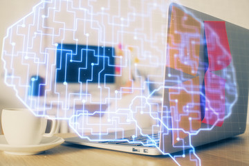 Double exposure of work space with computer and human brain drawing hologram. Brainstorm concept.