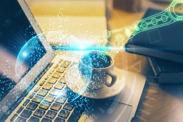 Double exposure of desktop computer and technology theme hologram. Concept of software development.