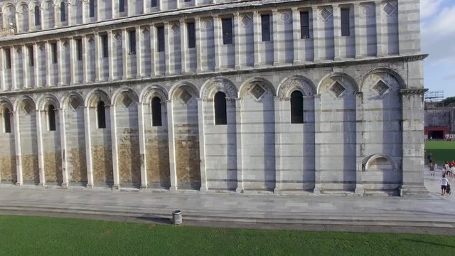 Square of Miracles and city cathedral in Pisa, Italy. Aerial view on a sunny summer day in slow motion
