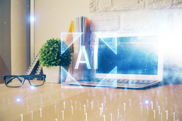 Double exposure of desktop computer and technology theme hologram. Concept of software development.