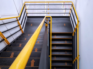 The walkway shows safe climbing using the yellow arrows to indicate walking direction, Fire escape...