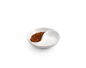 Cayenne pepper with sugar in bowl on isolated white background
