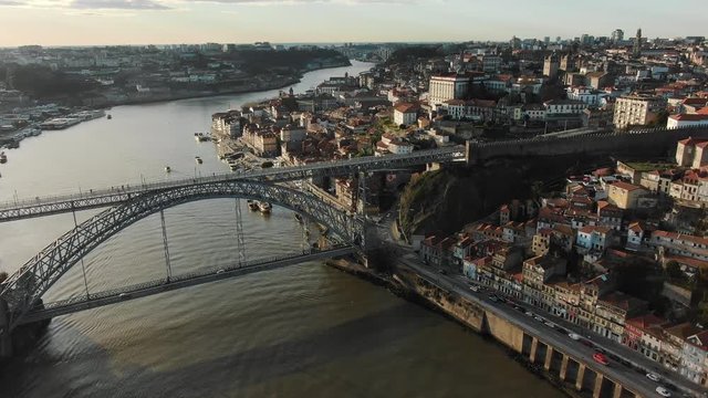 Porto downtown with small buildings and old metal bridge