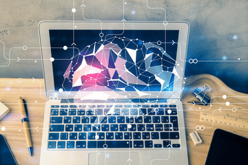 Multi exposure of work space with computer and human brain hologram. Brainstorm concept.