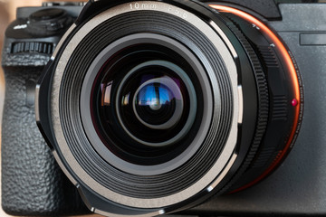 Fototapeta na wymiar DSLR mirrorless camera with wide-angle lens