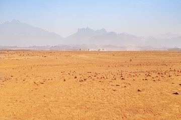 Hot desert with mirage on a background of mountains © Viktor