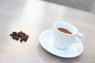 cup of coffee with beans