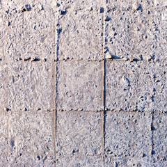 Concrete wall with rusty reinforcement rods background.Texture of old gray concrete wall for background