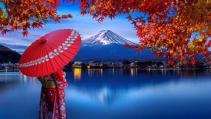 Asian woman wearing japanese traditional kimono at Fuji mountain. Autumn at Kawaguchiko lake in...
