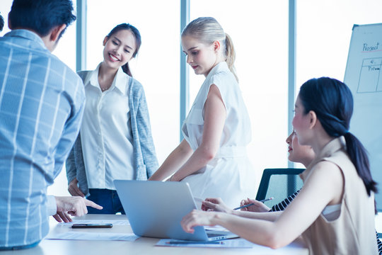 Group Of Business People Brainstorm To Solve Problem And Presentation In Teamwork. Woman Discuss With Manger And Colleague Team In Meeting Room. Business Finance And Communication Planning Concept.