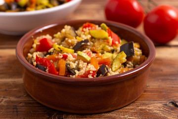 Cous cous with vegetables. oriental recipe that adapts to the characteristics of a vegan and vegetarian dish. Summer food, summer lunch.
