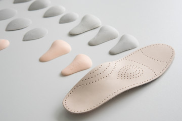 Orthopedic insole on a white background. Treatment and prevention of flat feet and foot diseases....