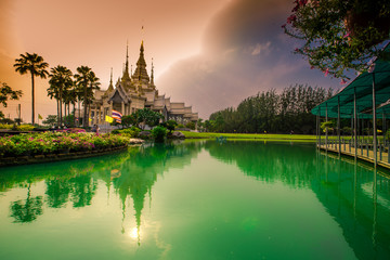 Wallpaper Wat Lan Boon Mahawihan Somdet Phra Buddhacharn(Wat Non Kum)is the beauty of the church that reflects the surface of the water,popular tourists come to make merit and take a public photo