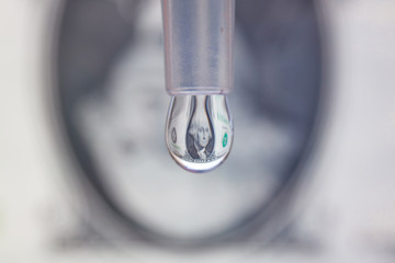 One dollar bill reflects in a drop. Saving money or last dollar concept © Руслан Мен