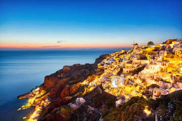 Illuminated Oia Village at Sunset on Santorini Island
