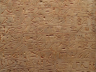 old egypt hieroglyphs carved on the stone