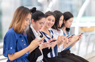 Group Asia women using smartphone and checking information on phone
