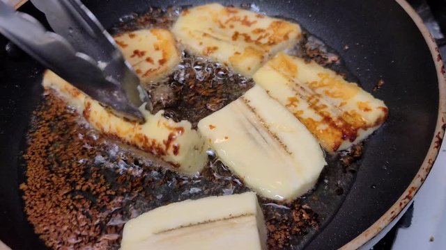 Frying bananacue with brown sugar
