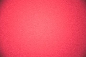 Texture of a red painted wall. Rich red color with vignetting.