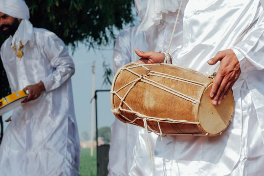 Hand beating drum in an Indian tradition