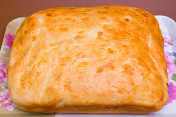 Fresh homemade tasty loaf of crunchy bread on the table