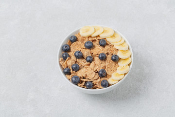 Multigrain wholewheat healthy cereals with fresh berry blueberry and banana for breakfast. Diet food or healthy food in the morning. 