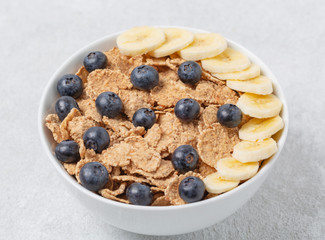 Multigrain wholewheat healthy cereals with fresh berry blueberry and banana for breakfast. Diet food or healthy food in the morning. 