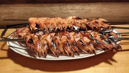 shrimp skewers. fried in the park tiger shrimp skewers