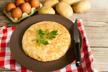 Spanish omelette with knife