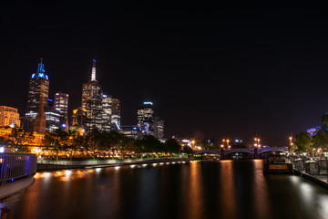 Fototapeta na wymiar The cityscape of Melbourne city near Yarra river at night in Australia