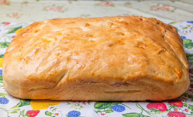 Fresh homemade tasty loaf of crunchy bread on the table