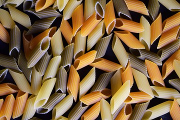 Coloured pasta background, in this image macaroni