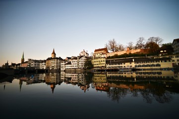 Fototapeta premium Limmat with old houses facade and Lindenhof in the morning in the city of Zurich Switzerland
