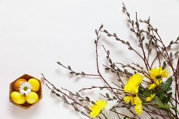Beautiful Easter still life with bouquet of pussy-willow twigs and yellow chrysanthemum flowers and...