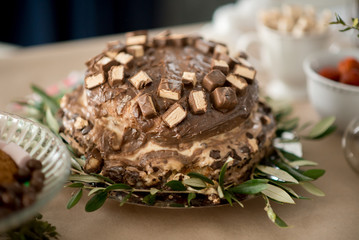 Baby's birthday cake with chocolate and sweets
