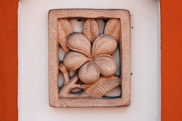 Ancient decorative flower ornament on the wall