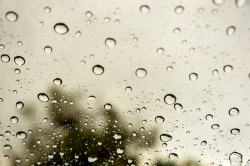 Rainwater on the glass of the car.