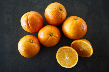 oranges on a black background. Health and vegetarian concept.
