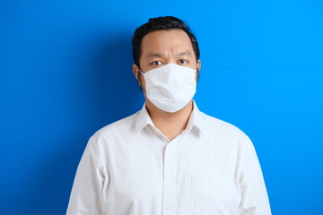 a fat Asian man wearing a mask