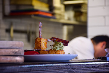 The dessert is on white dish at the kitchen in restaurant in Australia