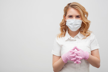 A woman in a mask and gloves with a friendly look is located to the right of the text space. Concept of preventive measures against coronovirus, protection from infection, medical care.