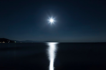 Fototapeta na wymiar Moonlight night on lake Sevan in Armenia