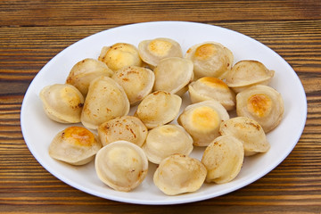 fresh hot appetizing dumplings on  plate