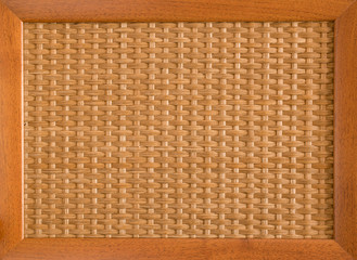 Textured wicker cane net in a wooden frame