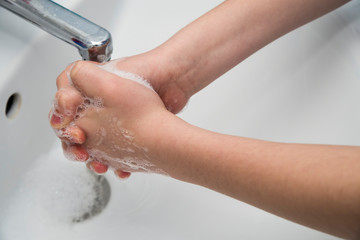 Fototapeta premium Hands washing with soap