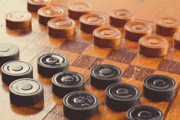 Old wooden checkers board game