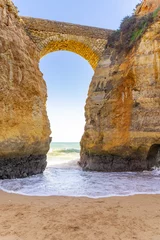 Foto auf Acrylglas Strand Marinha, Algarve, Portugal Rocks and ocean waves on the shore of Atlantic ocean in Algarve Portugal. 